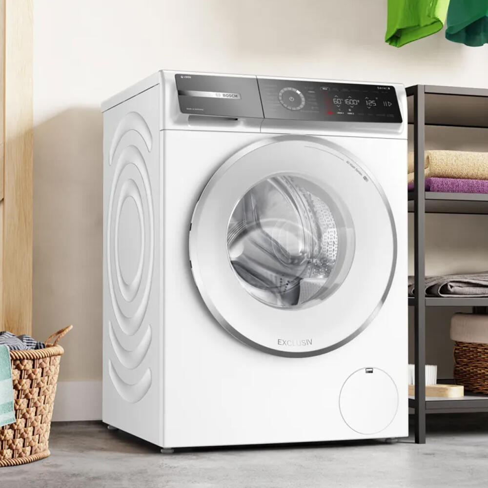 Wasmachine met een groen-blauwe achtergrond.